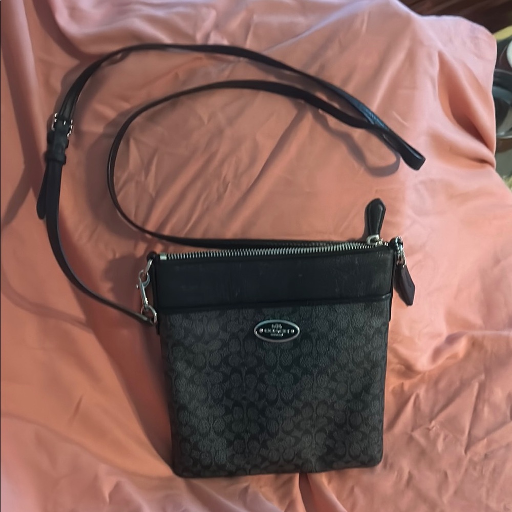 Coach Black Crossbody Bag with Monogram Pattern and Adjustable Strap